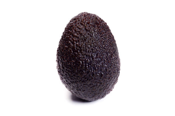istock Whole hass avocado with in peel isolated on white 1487116097