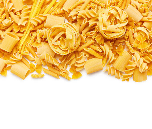 Border of different type of pasta isolated on white background stock photo