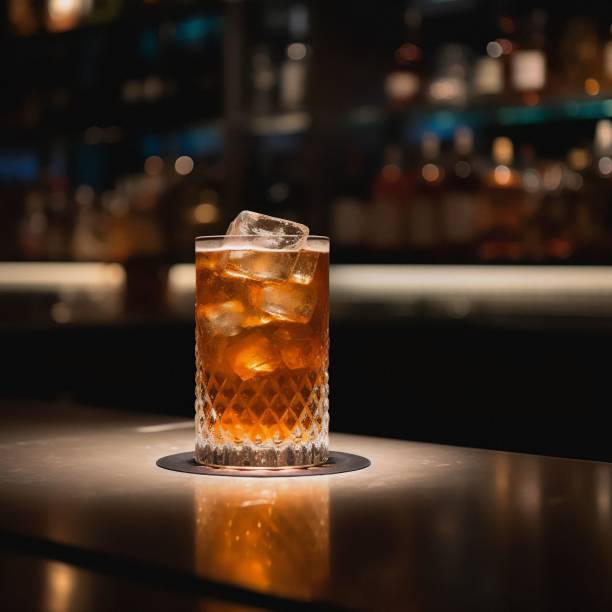 istock an alcoholic drink is on the bar and lit up with a warm glow 1487117702