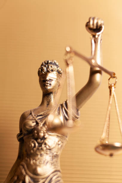 istock lady justice on gold background 1487118267