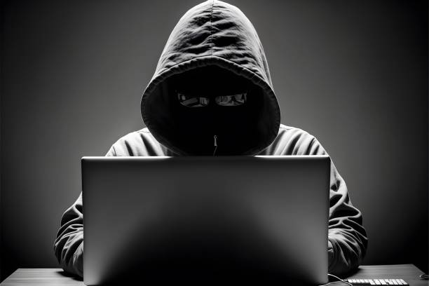 istock Illustration of a hacker with a laptop 1487123644