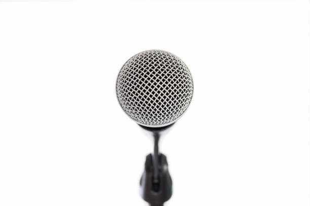 istock close front view of a profosssionnal microphone isolated on white background 1487131218