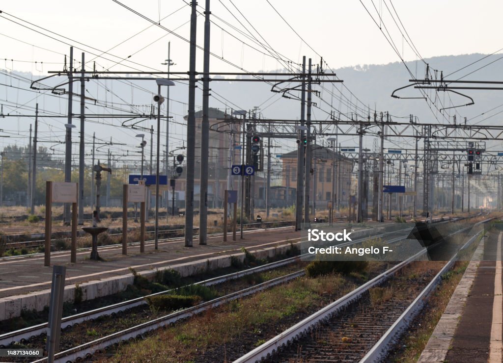 railway station of an Italian city with travelers travelers railway station of an Italian city with travelers Architecture Stock Photo