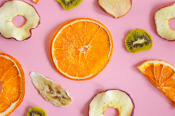 istock Various dry fruits on a pink background. Healthy balanced diet. 1487136755