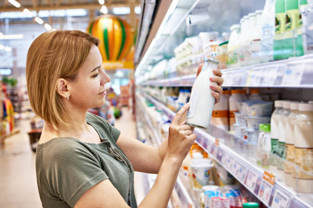 istock Woman shopping milk 1487138210