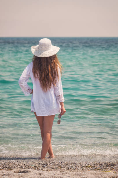 istock Young girl on vacation having fun at the beach 1487141150