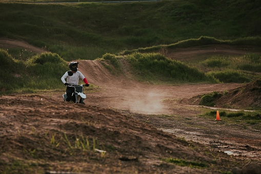 Poland, Poznan - July 30, 2007: A young man riding a motorcycle in beginer level group, during the course of improving driving skills with motorcycle on the race track in Poznan. 