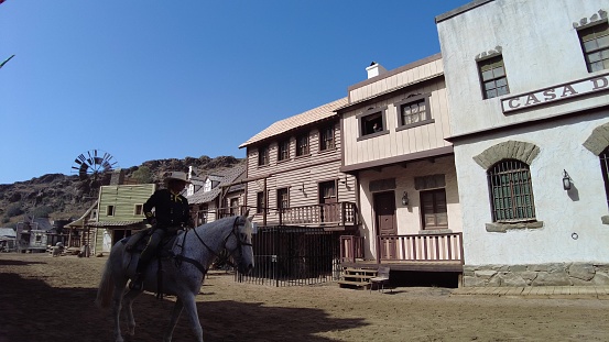 Gran Canaria - April 2023: Step into Sioux City theme park and instantly transform into a cowboy or Indian. Explore the town, witness a thrilling bank robbery and watch the sheriff take on outlaws.