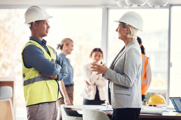 istock Construction team, architecture meeting and engineer collaboration with industrial worker group. Real estate, building management and employee communication of property development employees 1487149234