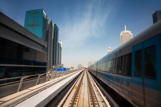 istock Modern skyscrapers along the metro line in Dubai, UAE 1487151671
