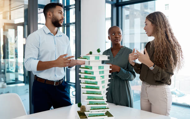 istock 3d, model architect and design team meeting in boardroom to discuss building structure plan. Teamwork, construction and industrial career in engineering project management and logistics. 1487151907