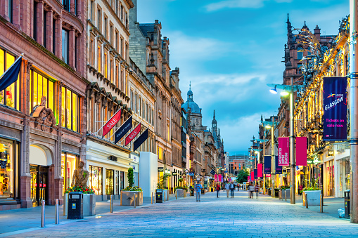 Buchanan Street in downtown Glasgow, Scotland at twilight. Buchanan Street forms the central stretch of Glasgow's famous Style Mile shopping district.