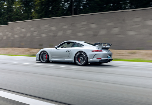 Seattle, WA, USA
May 2, 2023
Porsche 911 in silver driving on the highway