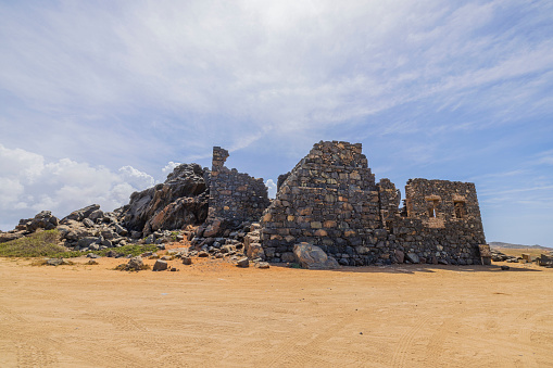 Scenic view of Bushiribana ruins on white clouds background. Aruba Island.