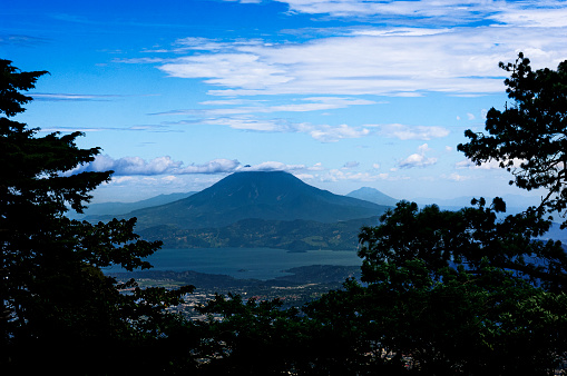 Distant view of Volcano San Vicente and Lake Ilopango near the city of San Salvador.