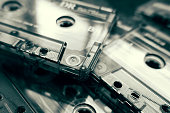 Closeup of audio cassettes in black and white tone