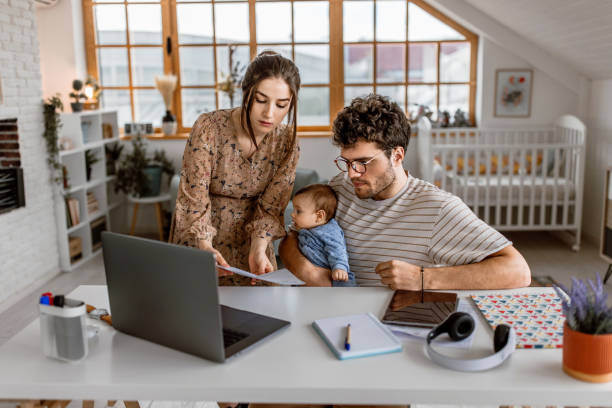 istock Young family doing financial planning at home 1487173325