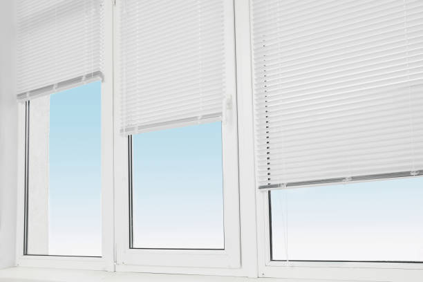istock Stylish window with horizontal blinds in room 1487173372