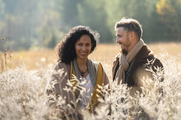 istock A romantic walk of lovers on the grass. 1487185741