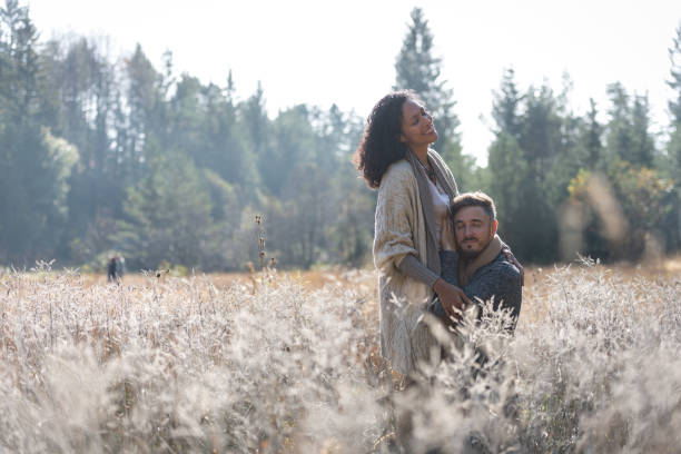 istock A romantic walk of lovers on the grass. 1487185747