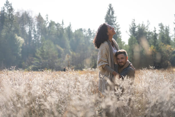 istock A romantic walk of lovers on the grass. 1487185749