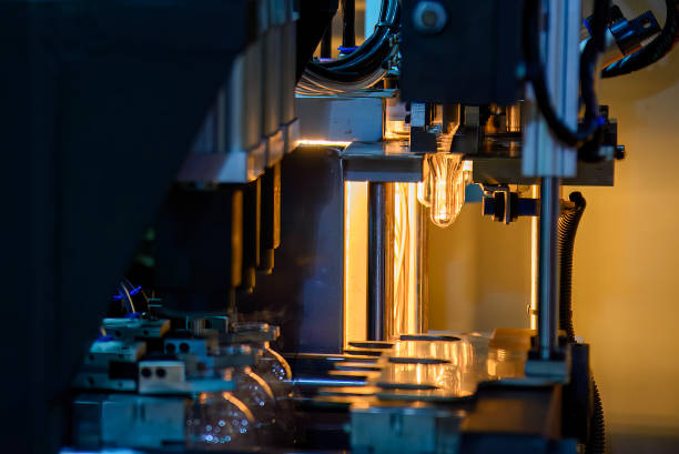 istock The drinking water bottle manufacturing process by blow mold machine. 1487189911
