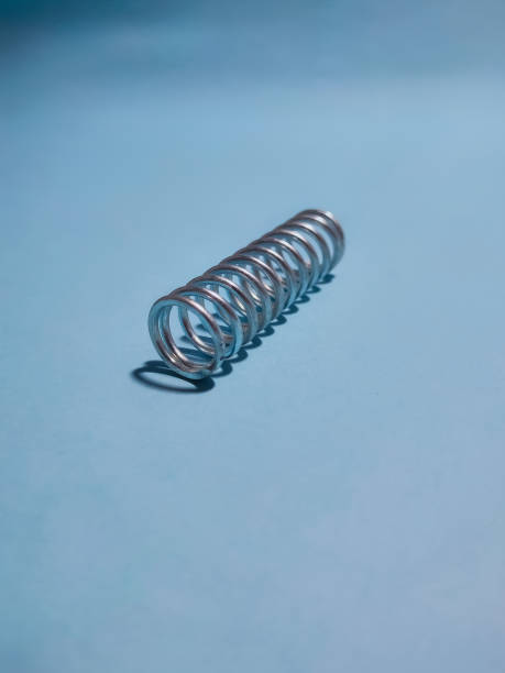 istock Spiral iron springs for machines are on a blue table 1487192808