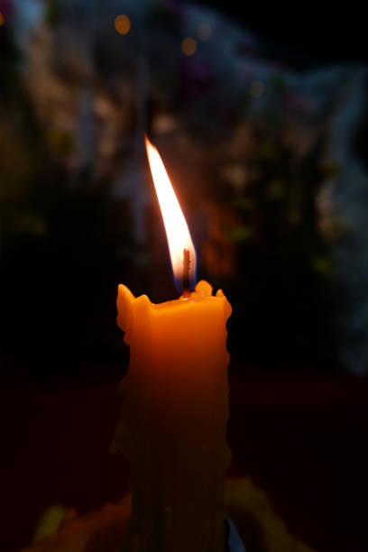 istock Fire burning candles in the dark background 1487194089