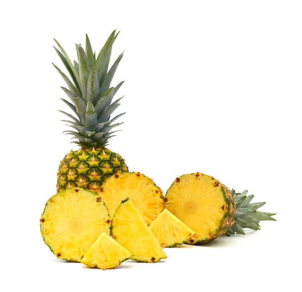 istock Fresh whole and slice pineapple on a white background. 1487198839