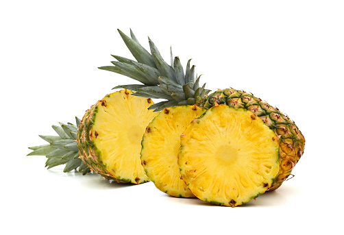 Fresh whole and slice pineapple. Isolated on a white background.