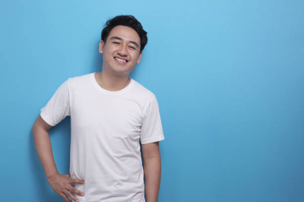 istock Happy young Asian man smiling at camera 1487202514