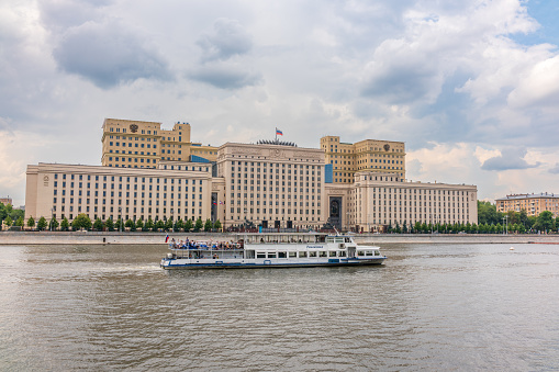 Moscow, Russia - July 28, 2022: View of the Ministry of Defence of Russian Federation, and Moscow river embakmenTranslation of the inscription on the facade - Ministry of Defense of the Russian Federation