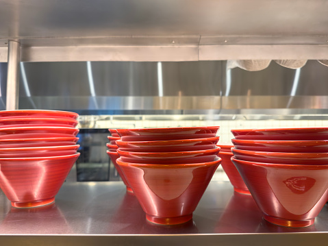 Bowls on a shelf in an industrial kitchen