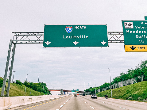A highways sign leads drivers to Greensboro, NC, USA.