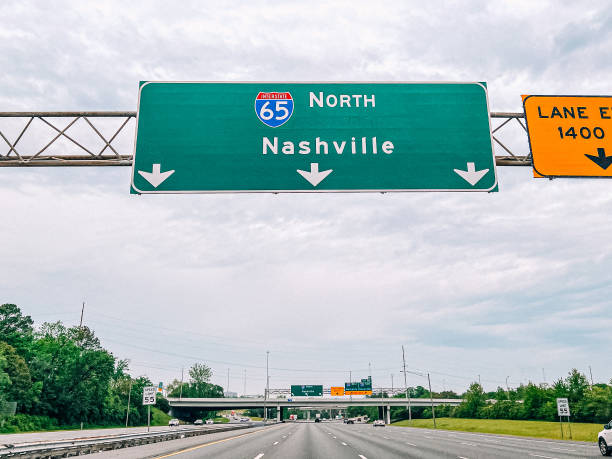 Driver's Perspective View of a "Nashville" Directional Sign on Interstate 65, Driving North Driver's Perspective View of a Nashville Directional Sign on Interstate 65. Taken near Oak Hill, Brentwood, Tennessee, in Williamson or Davidson County, Driving North tennessee road sign stock pictures, royalty-free photos & images