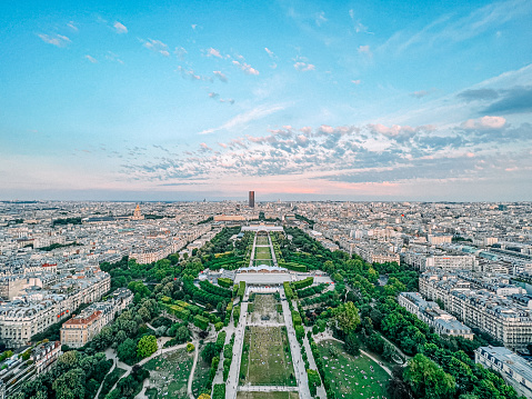 High Angle View from Eiffel Tower of Champ de Mars Park on a Summer Evening. Grand Palais Éphémère is centered at the southeast end of the park.