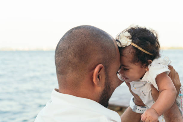 istock African dad plays with his baby 1487212389