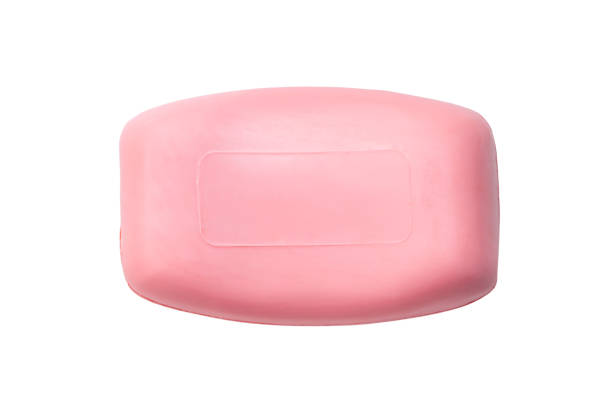 Single dry pink soap bar isolated on white background with clipping path