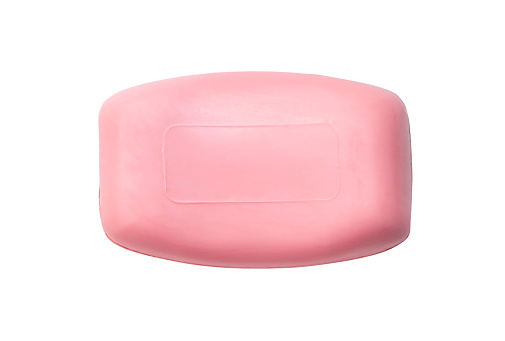 Single dry pink soap bar is isolated on white background with clipping path.