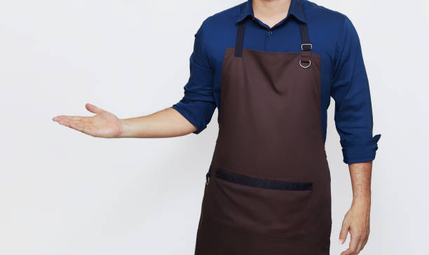 istock Asian Man wearing Apron, one hand showing something 1487215055