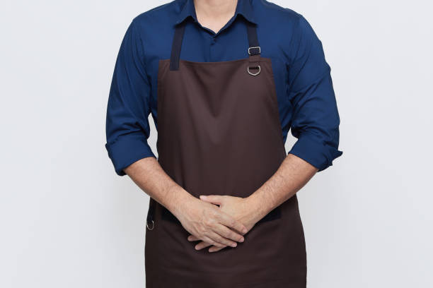 istock Asian Man wearing Apron, both hands in the apron pocket 1487215061