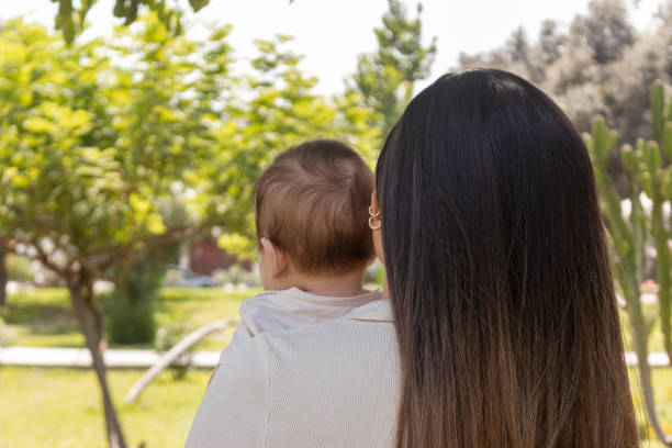 istock Mother and her baby in the park 1487216295