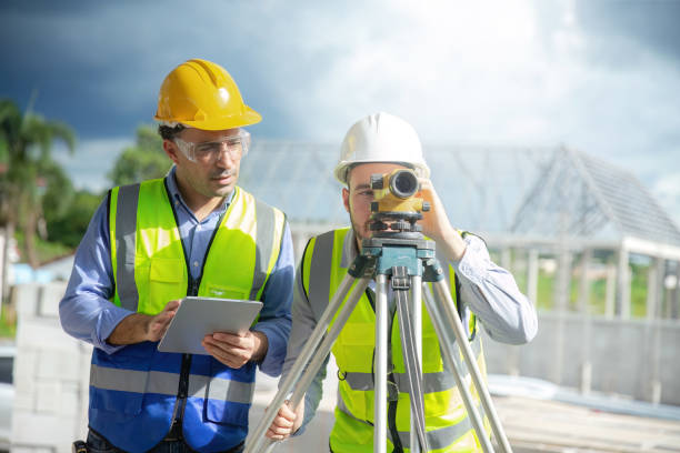 istock Engineer working at construction site surveying and surveying equipment 1487217958