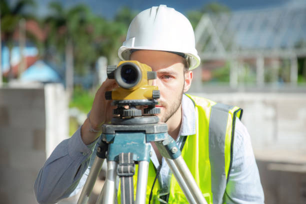 istock Engineer working at construction site surveying and surveying equipment 1487217961