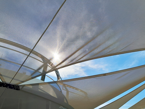 Sun shade sails with sky background