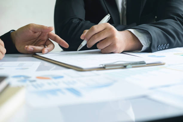 istock Business man sign a contract investment professional document agreement. 1487220288