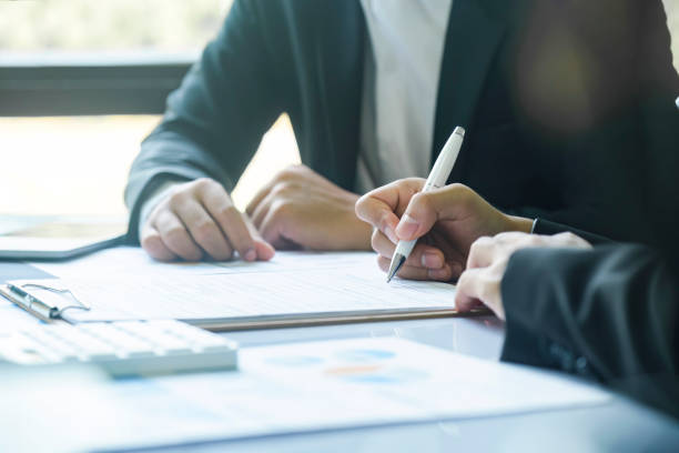 istock Business man sign a contract investment professional document agreement. 1487220290