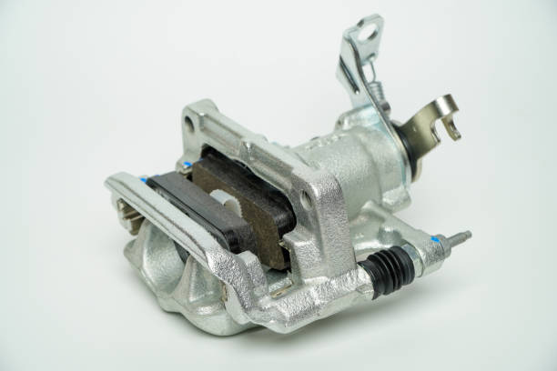istock Rear brake caliper with brake pads isolated on white background,Car part on a white background, close-up, isolate. 1487220595