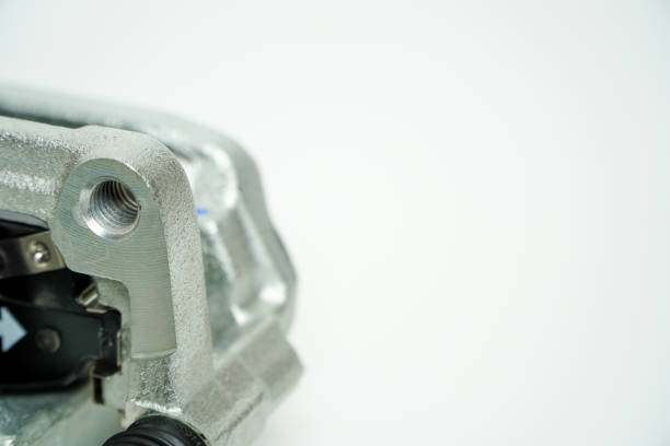 Rear brake caliper with brake pads isolated on white background,Car part on a white background, close-up, isolate.