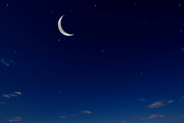 istock Crescent moon with lots of shining stars 1487223347